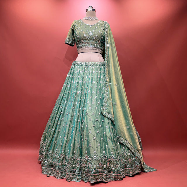 Green embellished lehenga set with beaded and pearl work, short-sleeve blouse and flared skirt