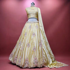 Butter yellow silk lehenga with pink and silver floral beadwork, full flare and dupatta