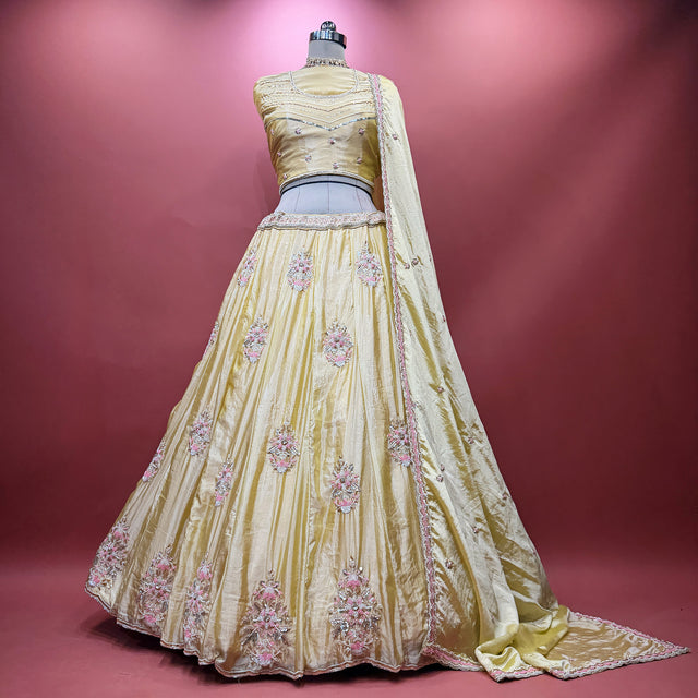 Butter yellow silk lehenga with pink and silver floral beadwork, full flare and dupatta