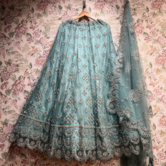 Sky blue net lehenga skirt with dense floral mirror-stone work and scalloped embroidered border