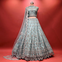 Sky blue net lehenga with mirror and stone embroidery, flared hem and matching dupatta