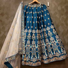 Royal blue threadwork lehenga skirt with gold motifs and sheer floral dupatta