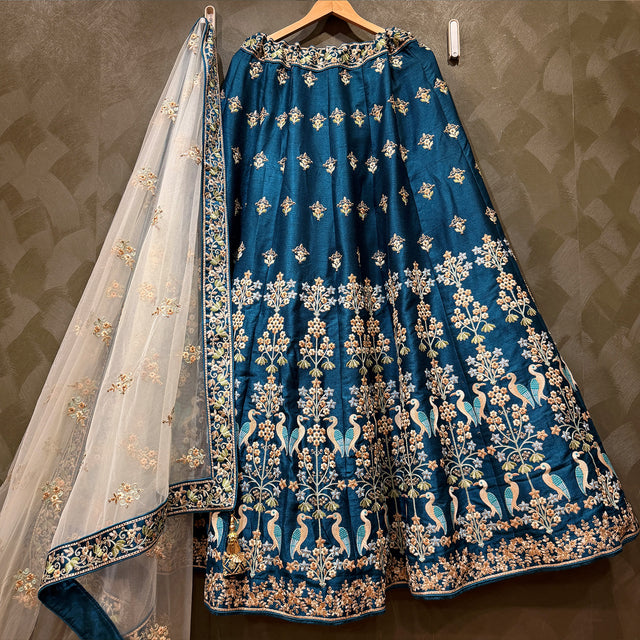 Royal blue threadwork lehenga skirt with gold motifs and sheer floral dupatta