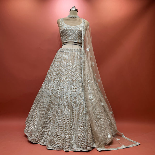 Ivory sequined lehenga with net dupatta