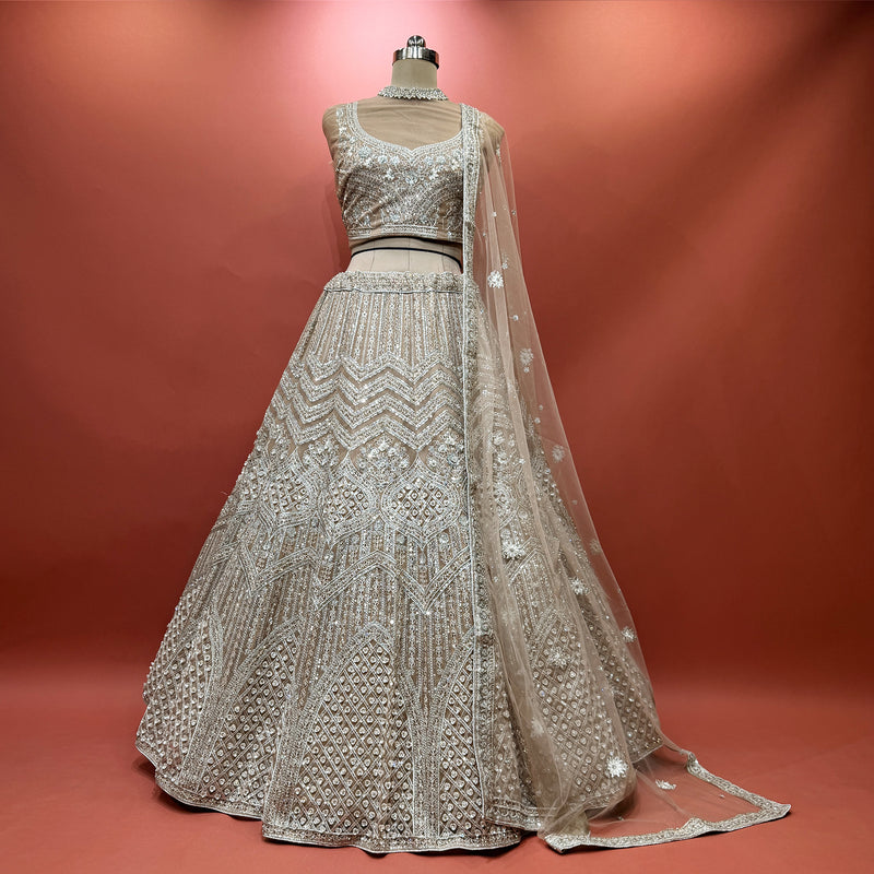 Ivory sequined lehenga with net dupatta