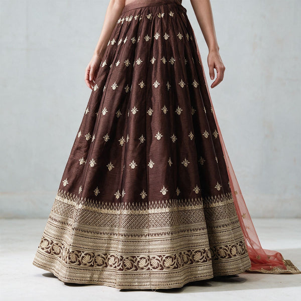 Chocolate-brown flared lehenga skirt with gold border and scattered butti embroidery