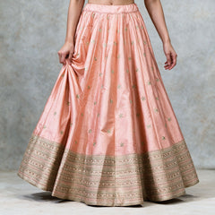 Peach raw silk lehenga skirt with scattered gold butis and layered gold embroidered hem