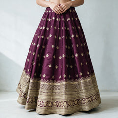 Wine raw silk lehenga skirt with scattered gold butis and layered gold embroidered hem