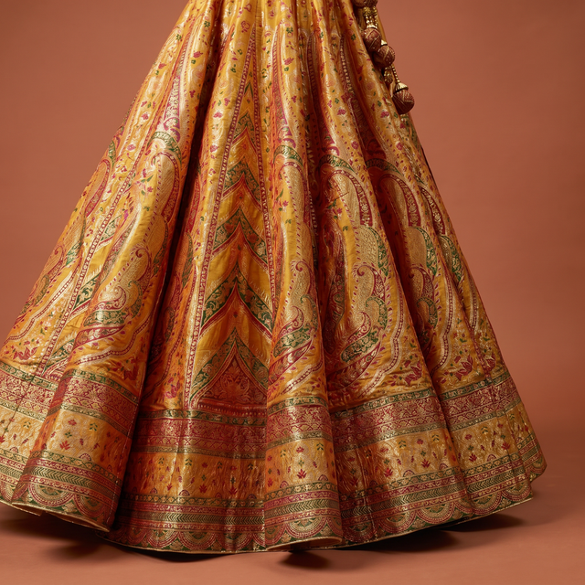 Yellow flared lehenga skirt with multicolor paisley and border detailing