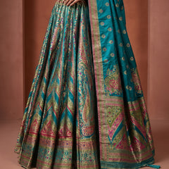 Teal green flared silk lehenga skirt with multicolor geometric and floral patola motifs