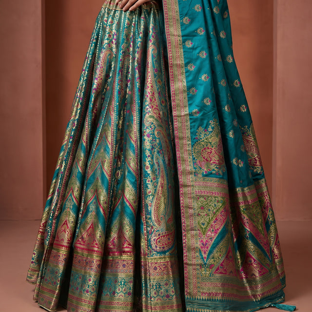 Teal green flared silk lehenga skirt with multicolor geometric and floral patola motifs