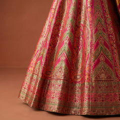 Flared lehenga skirt in pink and gold with intricate Patola-style woven motifs