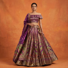 Wine and purple silk flared lehenga with ornate woven print and short off-shoulder blouse
