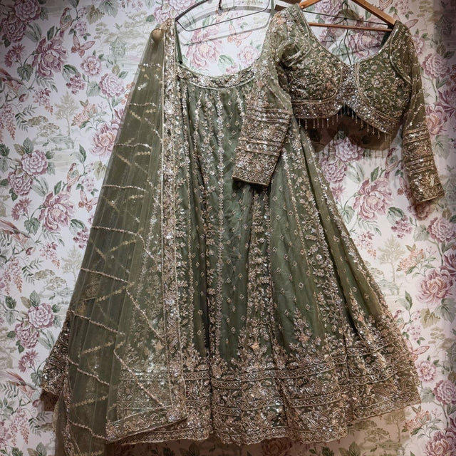 Olive net lehenga set with gold cutdana and sequin work, blouse and dupatta