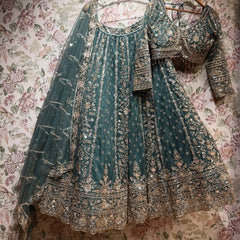 Teal net lehenga set with gold cutdana and sequin work, blouse and dupatta