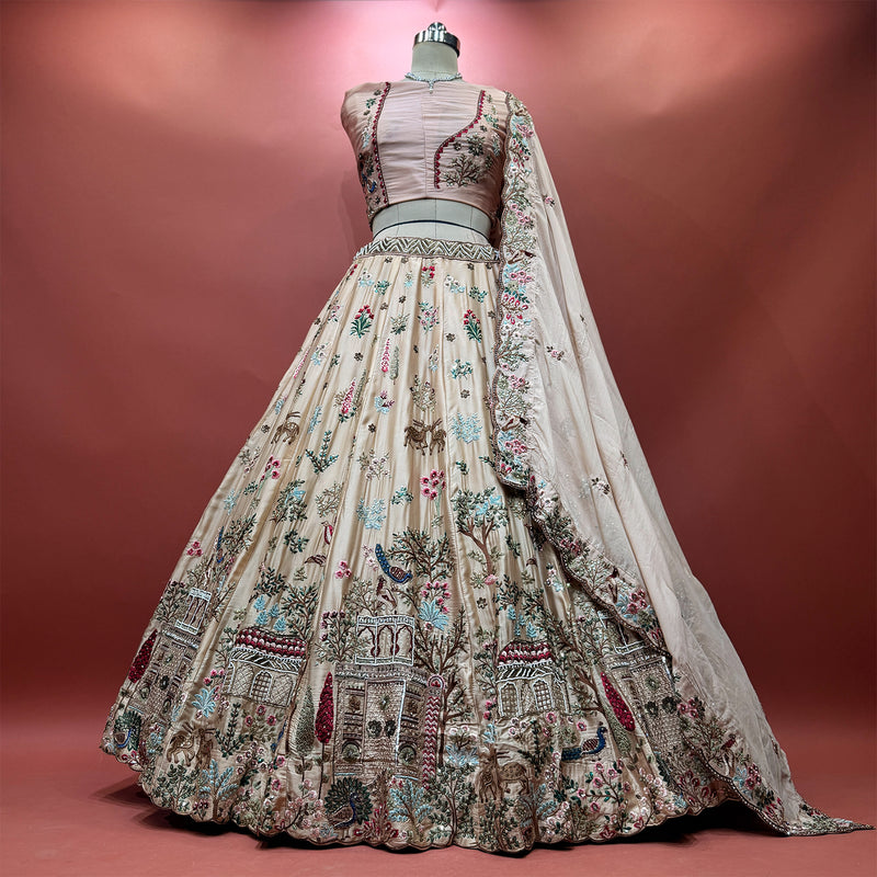 Peach multicolour soft silk lehenga with moti handwork over resham animal and bird motifs, with a matching soft silk dupatta