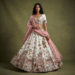 White lehenga with multicolor floral tree motif, pink dupatta, embellished border
