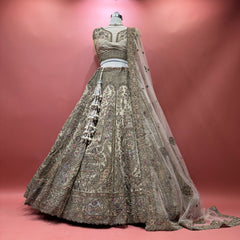 Golden ivory embellished lehenga with matching net dupatta, zari and stone motifs