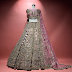 Rose pink net lehenga with silver zari embroidery, stone details, and matching dupatta