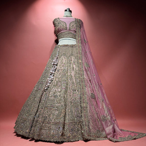 Rose pink net lehenga with silver zari embroidery, stone details, and matching dupatta