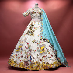 Ivory lehenga with multicolour motif, moti & cutdana embroidery, flared skirt and blue dupatta