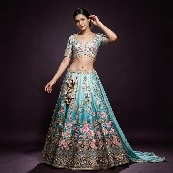 Sky-blue ombre lehenga with floral peacock handwork and embroidered cropped blouse