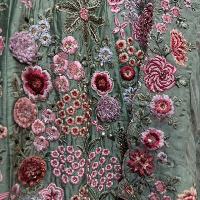 Close-up of pink, burgundy and lilac rose cutdana and resham handwork on sage green crape silk