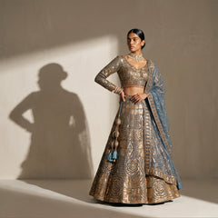 Teal blue lehenga set with gold embroidered crop blouse, long skirt and matching dupatta