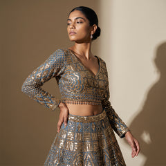 Teal blue gold-embroidered blouse and lehenga skirt with geometric pattern