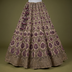 Maroon and gold sequin lehenga skirt with all-over pattern and tassel side embellishment