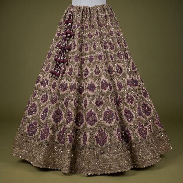 Maroon and gold sequin lehenga skirt with all-over pattern and tassel side embellishment