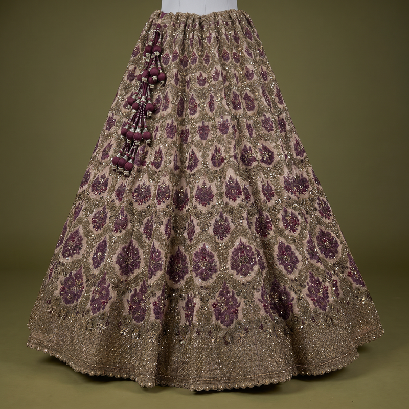 Maroon and gold sequin lehenga skirt with all-over pattern and tassel side embellishment
