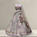Soft pink raw silk lehenga with embroidered bodice and matching dupatta