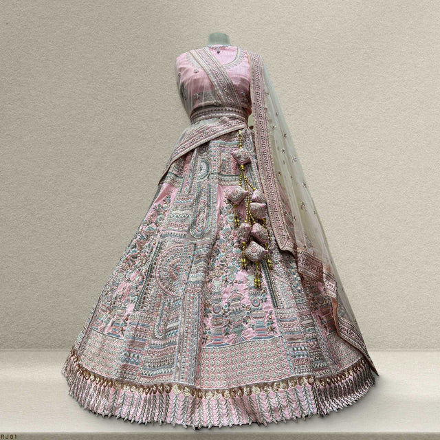 Soft pink raw silk lehenga with embroidered bodice and matching dupatta