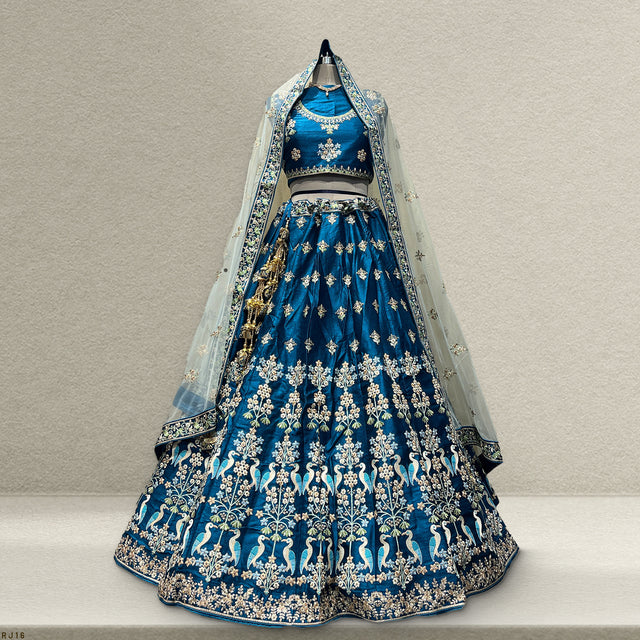 Royal blue lehenga skirt with gold threadwork motifs and sheer dupatta, back view