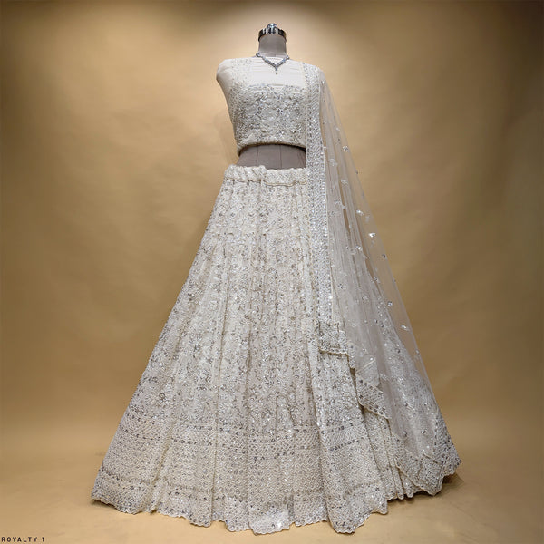 Off-white sequined lehenga skirt and fitted bodice with sheer dupatta