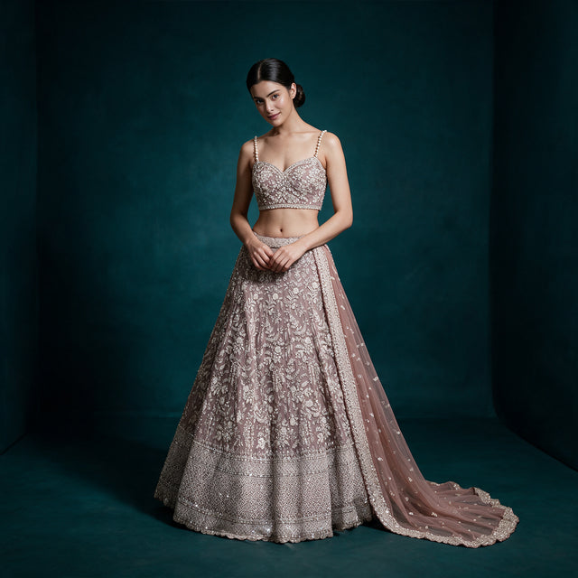 Lavender georgette lehenga with embellished sleeveless blouse, floral vine motifs