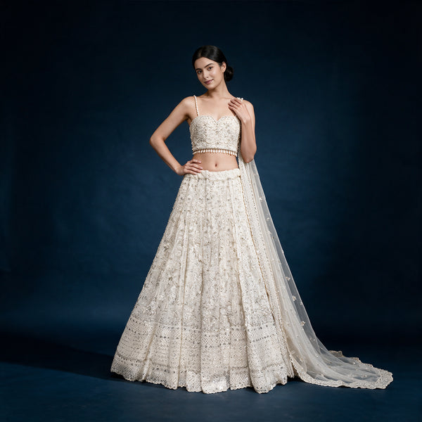 Off-white embellished georgette lehenga with tiered skirt and draped dupatta