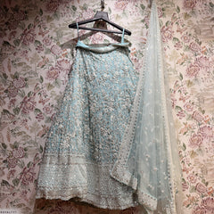 Sky blue lehenga on hanger with matching dupatta and silver floral embroidery