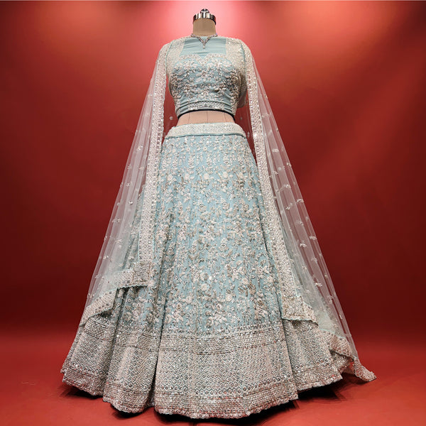 Sky blue lehenga with silver-toned floral vine embellishment and tiered skirt