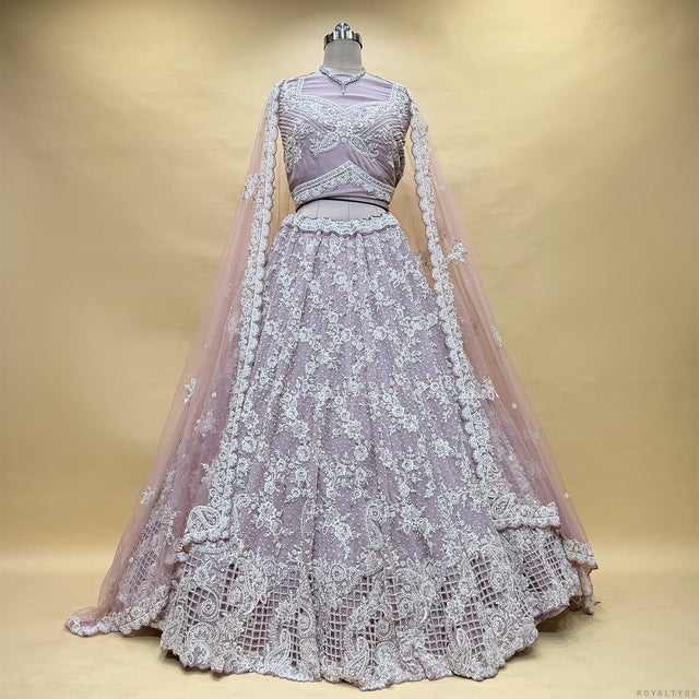 Lavender lehenga set on mannequin with back embroidery and sheer net dupatta