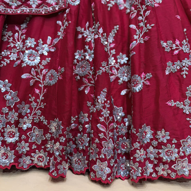 Deep pink-maroon lehenga skirt with dense silver floral embroidery and sequined motifs