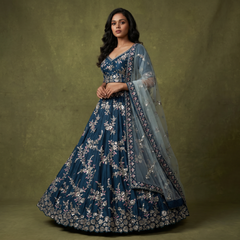 Blue embroidered designer lehenga with silver zari floral motifs and sheer dupatta