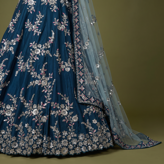 Blue lehenga skirt with silver zari floral border and draped sheer dupatta