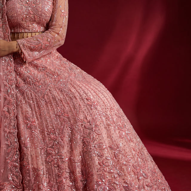 Blush pink embroidered lehenga skirt with beadwork, pearls, and detailed textured patterns