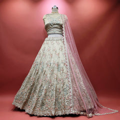 Ivory floral embroidered lehenga with scalloped hem and pink net dupatta