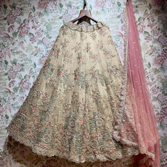 Ivory floral embroidered lehenga with ornate border and full gathered skirt