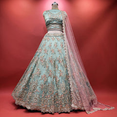 Sky blue lehenga with dense floral resham and cutdana embroidery, pink sheer dupatta