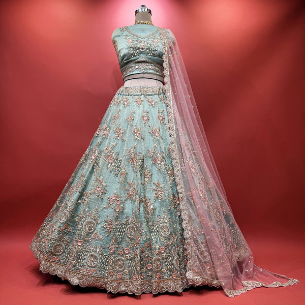 Sky blue lehenga with dense floral resham and cutdana embroidery, pink sheer dupatta