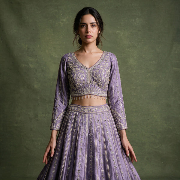 Lavender embroidered lehenga with full sleeves, fitted bodice, and scalloped hem